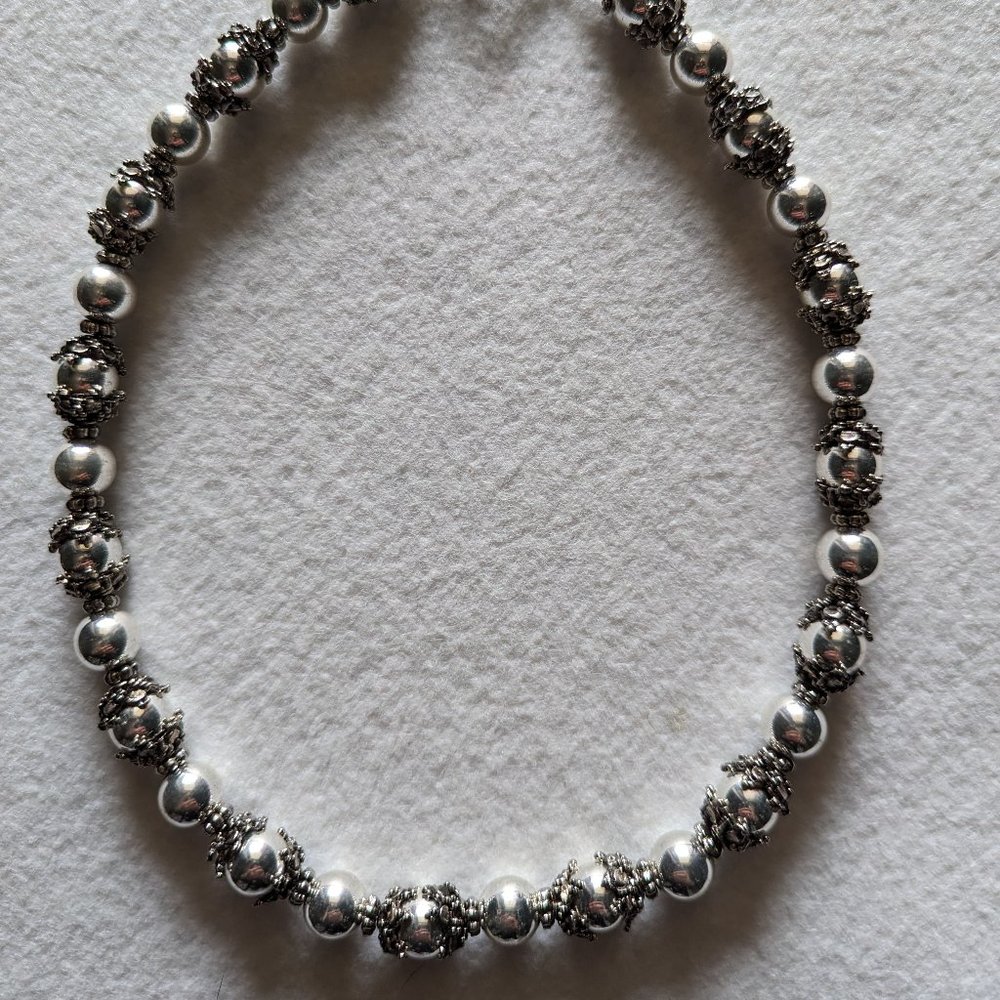 Necklace with post pierced earrings.